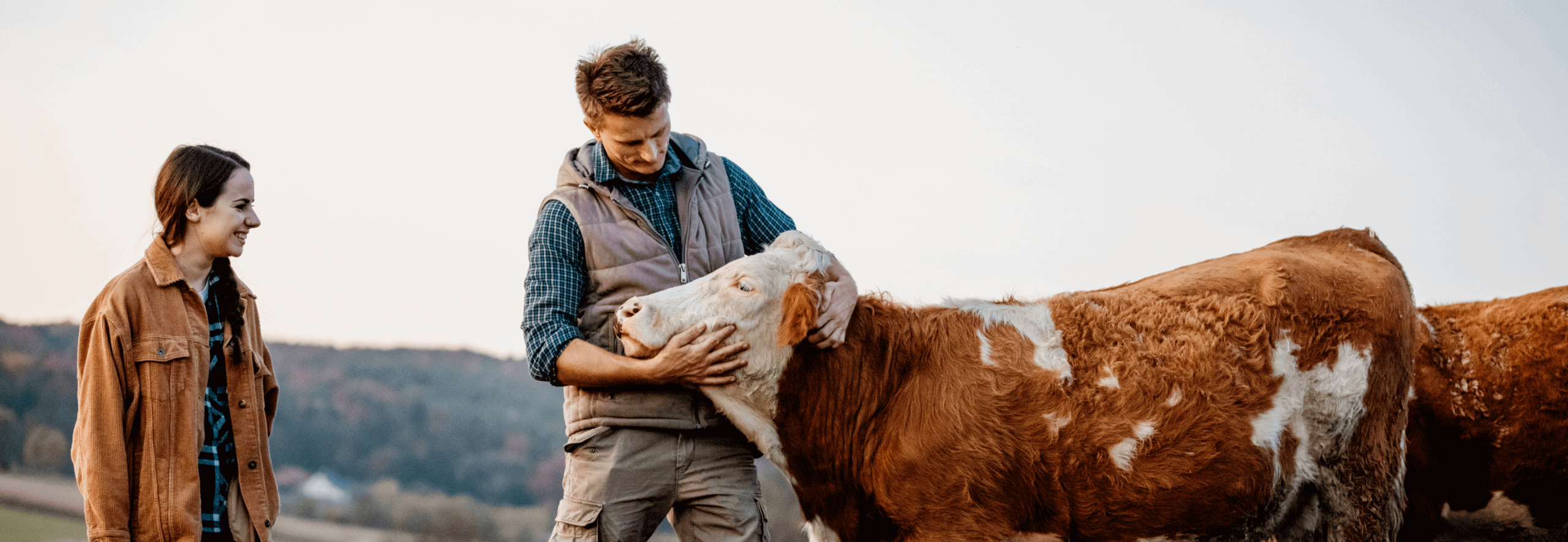 Farmer and daughter with cattle